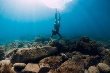 Girl underwater in ocean. Lady snorkeling in ocean
