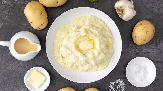 Rotating Bowl of Mashed Potatoes and Butter