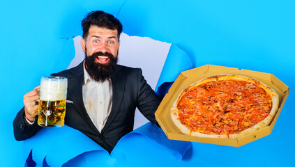 Smiling man with pizza and mug of beer. Fastfood. Italian food. Pizza delivery concept.