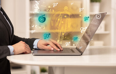 Doctor working on laptop with healthcare concept