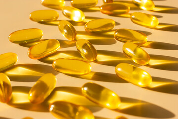 fish fat pills capsules vitamins omega 3 or hyaluronic acid are nutrients you get from food (or supplements) that helps build and maintain a healthy body. Dietary supplement. Macro, horizontal.