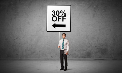 Obraz premium business person holding a traffic sign concept