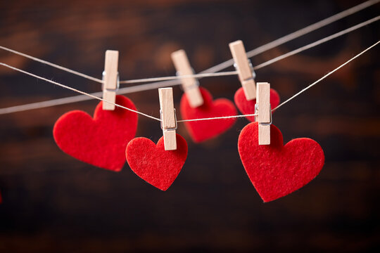 Red heart on wooden clothespin