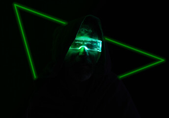 man in the dark with luminous glasses