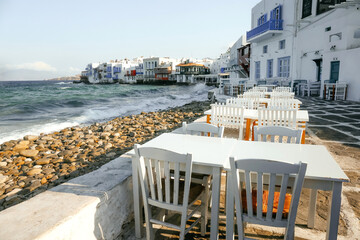 Street restaurant overlooking Little Venice, Mykonos Island, Greece.