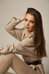Fototapeta premium Close portrait of young caucasian woman posing in white studio.