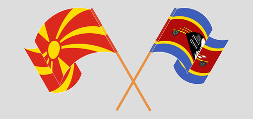 Crossed and waving flags of North Macedonia and Eswatini