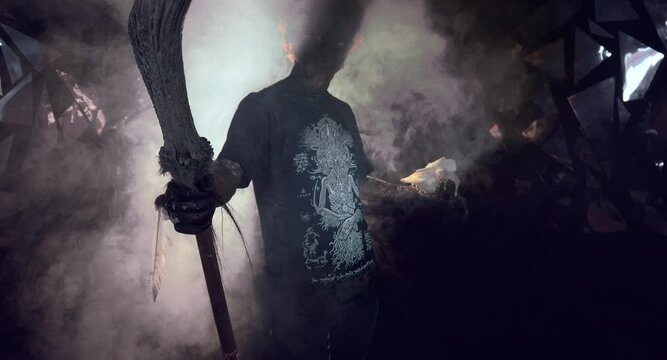scary sorcerer in smoke. voodoo rite
