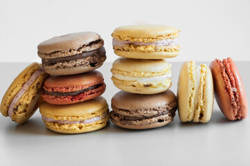 Close-up of a stack of macaroons against a gray background, front view, selective focus