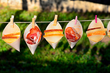 cornet with sausages such as ham, cheese, loin and sausage, placed on a rope, for decoration in...