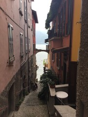A narrow cobbled alley in Varenna, a romantic village on Lake Como, Province of Lecco, Italy. Narrow street. Varenna