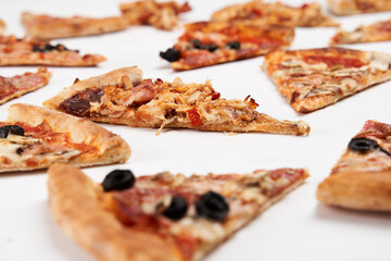 Pizza slices closeup isolated on white
