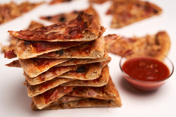 Pizza slices closeup isolated on white