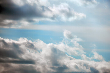 Blue sky background with dark white clouds before thunderstorm