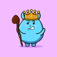 Cute cartoon goblin monster mascot as wise king with golden crown and wooden stick