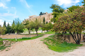 Acropolis Hill, with the Parthenon and the ancient ruins of the theater in view in the historic center of Athens, Greece.