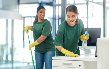 The deepest clean for complete peace of mind. Shot of two young woman cleaning a modern office. - Powered by Adobe