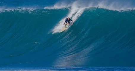 Fototapeten Surfer surfing big ocean barrel tube wave at Pipeline in north shore of Hawaii's Oahu island pro surfer Anthony Walsh © blvdone