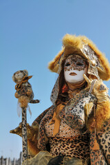 Plakat Venice, Italy - February 2022 - carnival masks are photographed with tourists in San Marco square