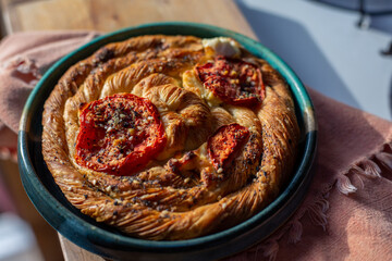 Savory tomato and goat cheese Danish pastry in the morning light