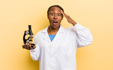 black pretty woman looking happy, astonished and surprised