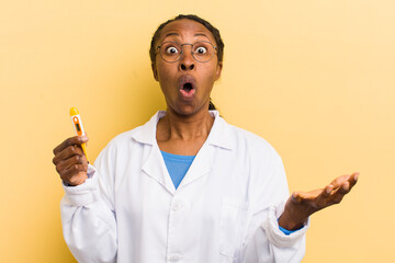 black pretty woman feeling extremely shocked and surprised