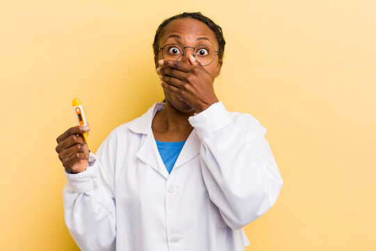 black pretty woman covering mouth with hands with a shocked