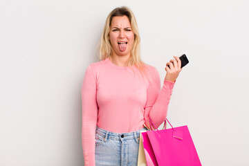 blonde pretty woman feeling disgusted and irritated and tongue out