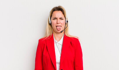 blonde pretty woman feeling disgusted and irritated and tongue out