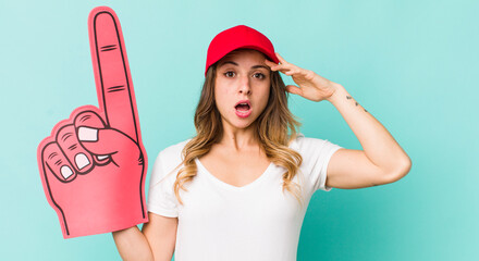 pretty woman looking happy, astonished and surprised