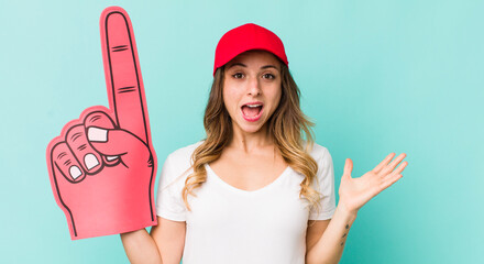 pretty woman feeling happy and astonished at something unbelievable