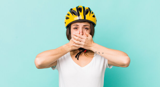 pretty woman covering mouth with hands with a shocked