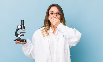 pretty woman covering mouth with hands with a shocked