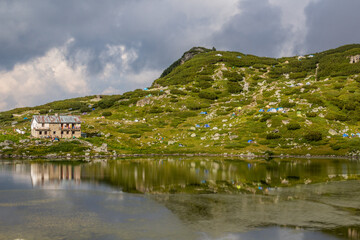 Fototapeta premium Chalet Seven Lakes and camping at Ribnoto (Fish) lake in Rila mountains, Bulgaria