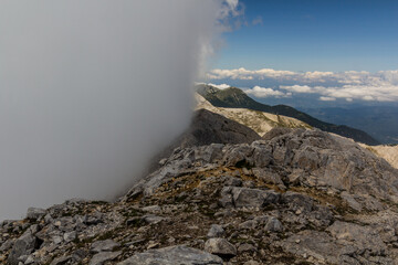 Koncheto ridge in Pirin mountains with fog at a side, Bulgaria