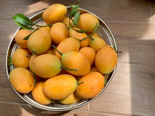 Marian Plum Or Plango Fruit in Basket - Thai Fruit, Tropical thai fruit. maprang, gandaria, plum mango.
