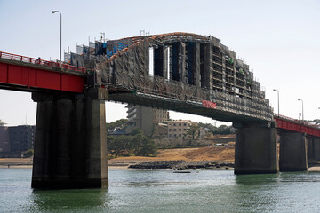 Ibaraki, Japan - March 5, 2022: Kaimon bridge under repair service on Naka river in Japan
