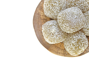 mochi cakes.Coconut mochi on a wooden board isolated on white background. Japanese traditional dessert with coconut. 