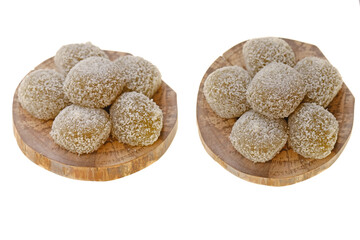 mochi cakes.Coconut mochi on a wooden round board isolated on white background. Japanese traditional dessert with coconut. 