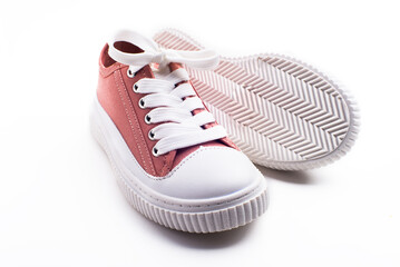 children's pink sneakers with white laces and soles