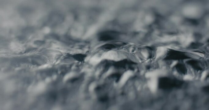 Hot Boiling Water Surface Drops Waves Evaporate In Macro Close Up