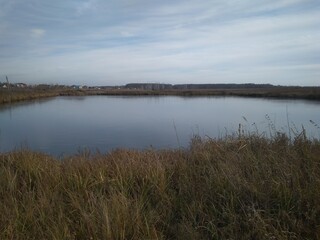 lake reservoir in autumn in cloudy weather cold climate in Siberia