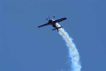 Aerobatic airplane against the background of blue sky