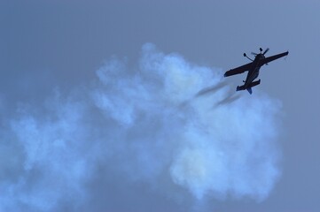 Aerobatic airplane against the background of blue sky