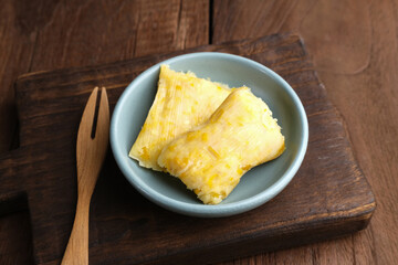 Lepet Jagung is a traditional Indonesian snack that is often found in Central Java, Indonesia, made from corn and grated coconut and wrapped in corn husks and steamed.
