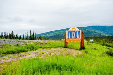 Alaska highway sign welcoming to the territory of Yukon