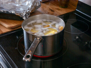 Potatoes boiling on stove