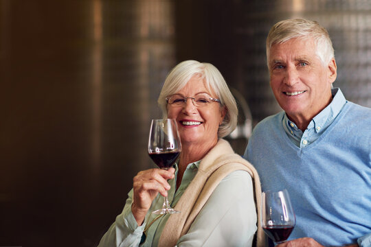 We enjoy a little wine tasting every now and again. Cropped portrait of an affectionate senior couple wine tasting in a cellar.