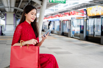 women in red dress in mrt