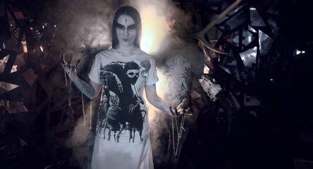 sorcerers stands in smoke. voodoo rite